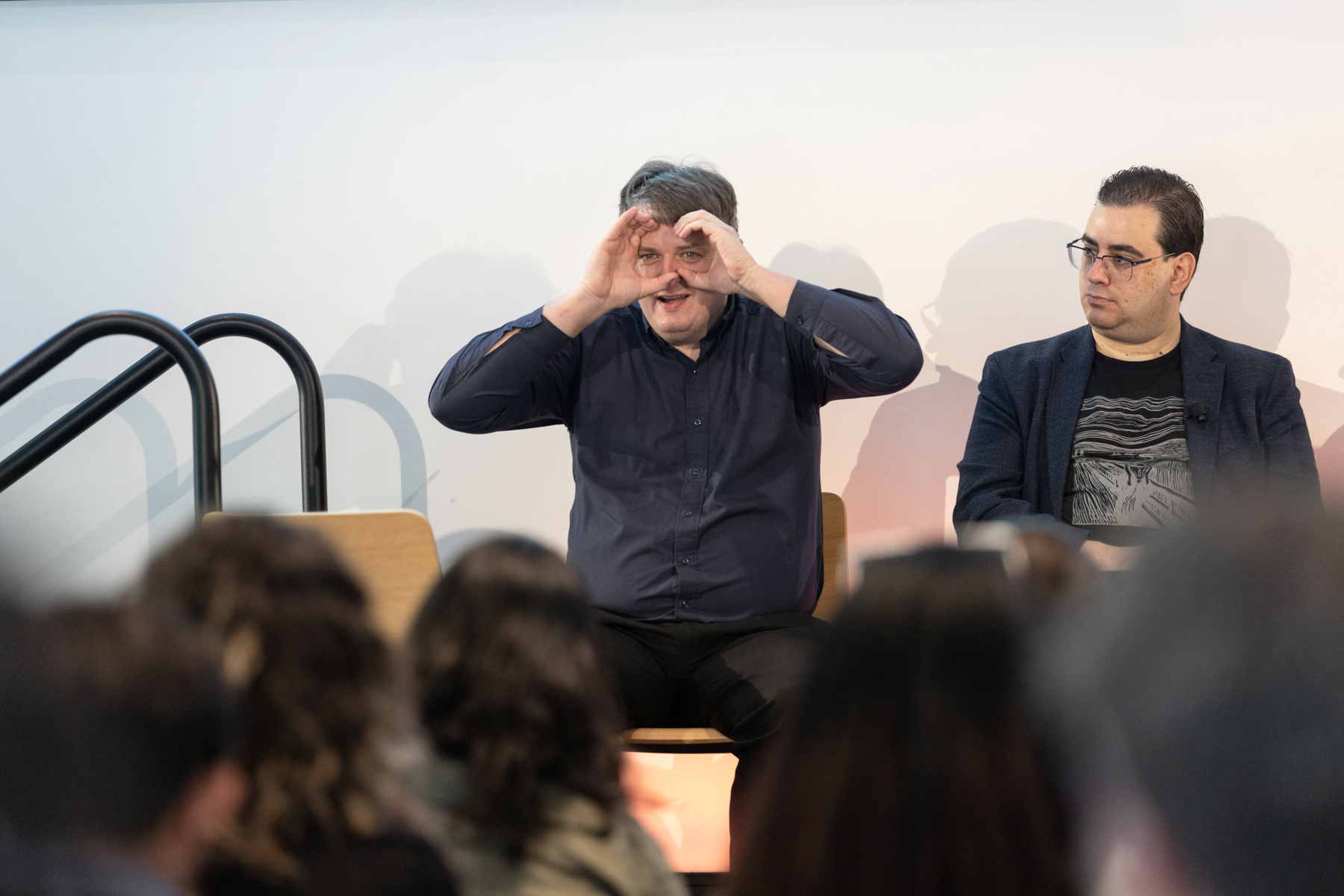 Christian Vogler on Workplace panel holds hands up to his eyes representing a VR headset