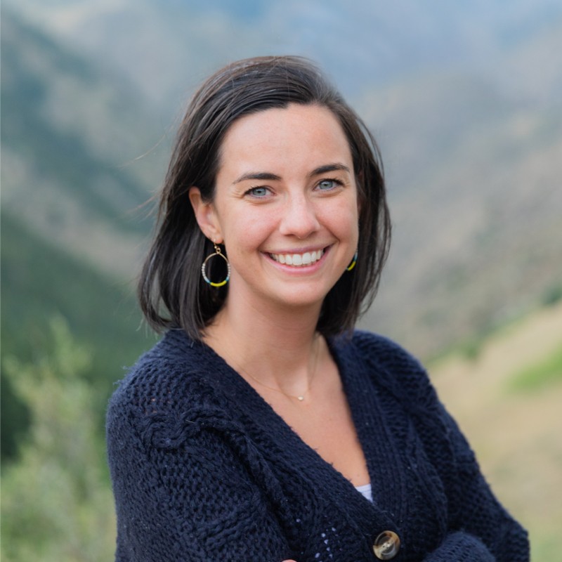 Headshot of Erin Leary, a light-skinned woman with black hair wearing a blue sweater.