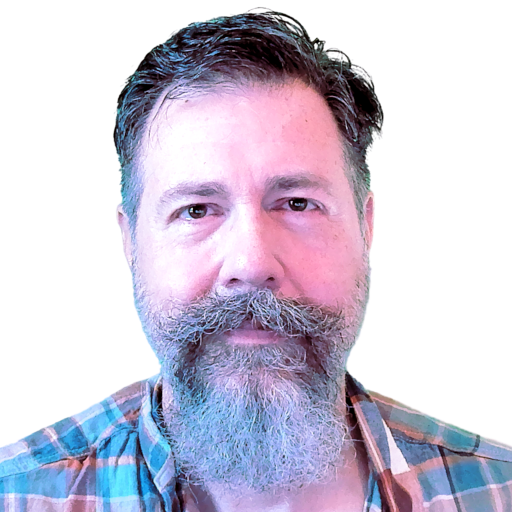 Headshot of Michael Cooper, a white man with sideswept brown hair, a medium-length salt and pepper beard, and wise eyes.